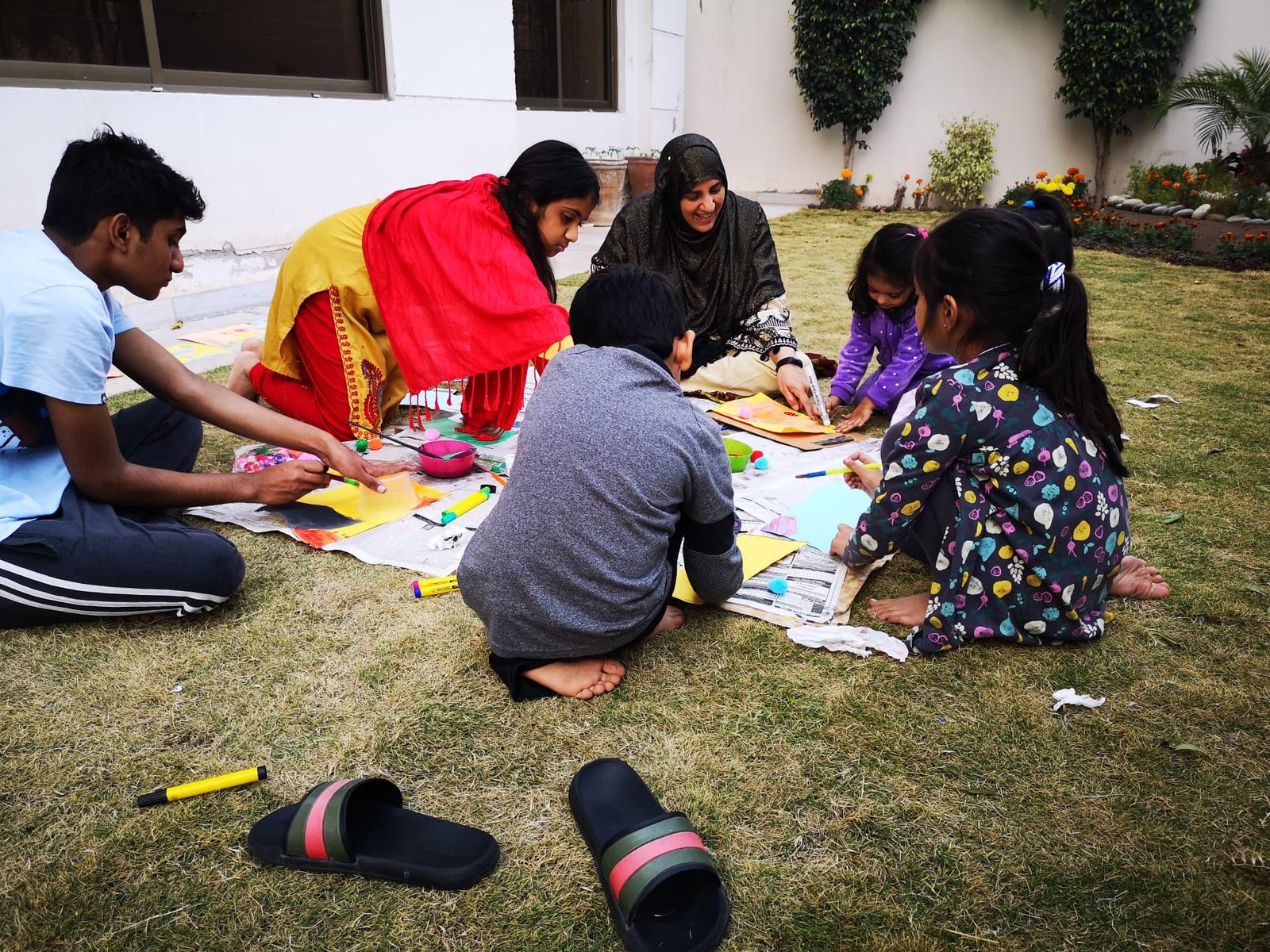 Nish sharing a painting activity with children in 2021